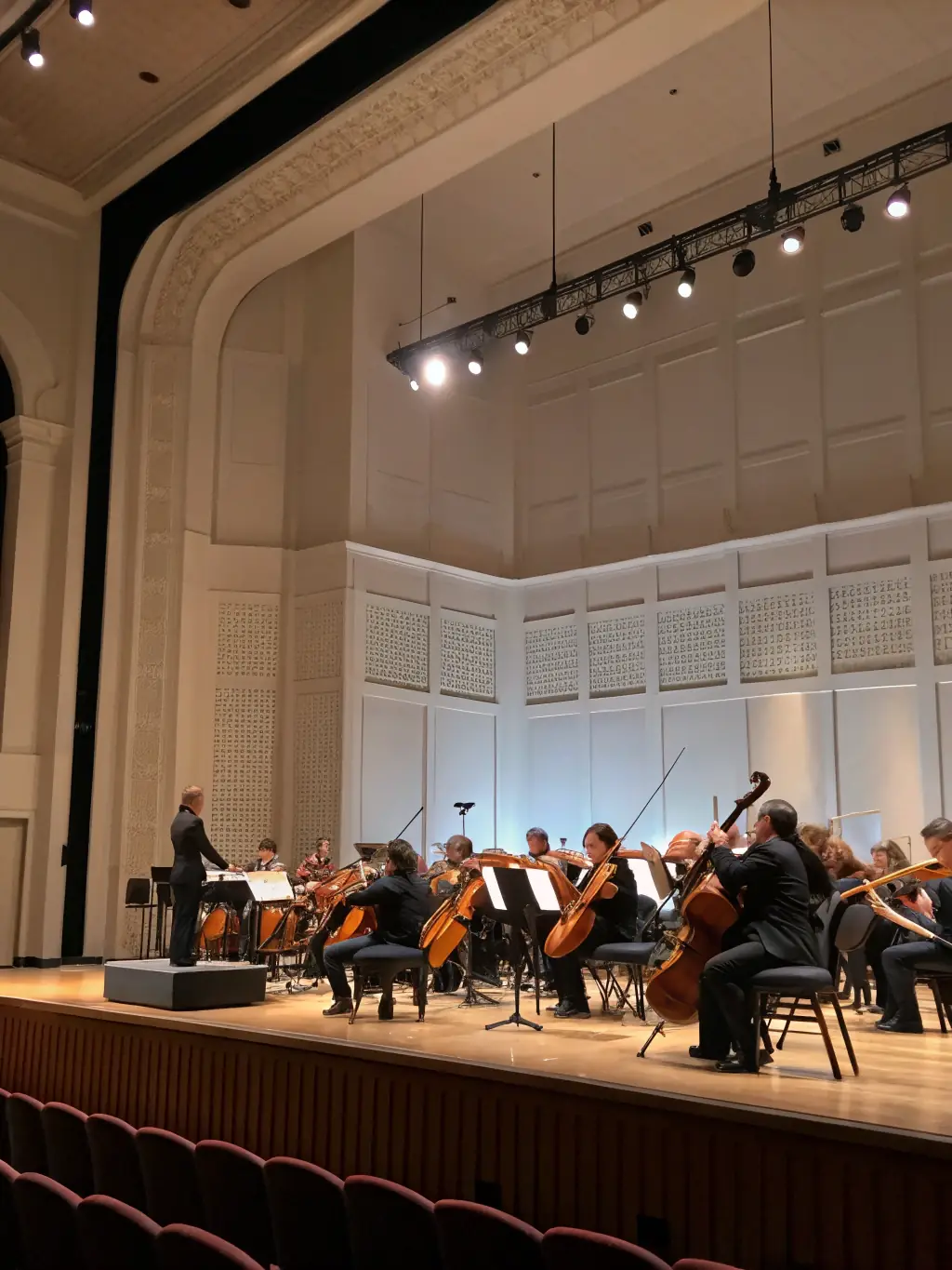 A photograph of a classical music concert held at MAGCP, with musicians performing and an audience enjoying the performance.
