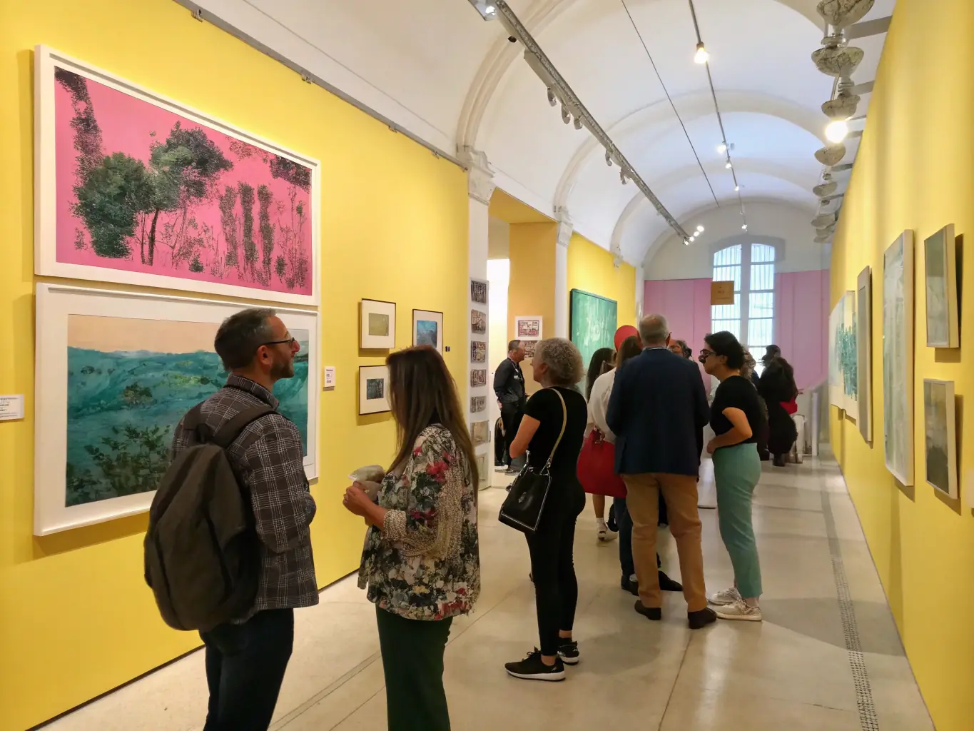 A vibrant contemporary art exhibition at MAGCP, featuring diverse artworks and engaged visitors, showcasing the organization's commitment to promoting modern art and cultural dialogue.